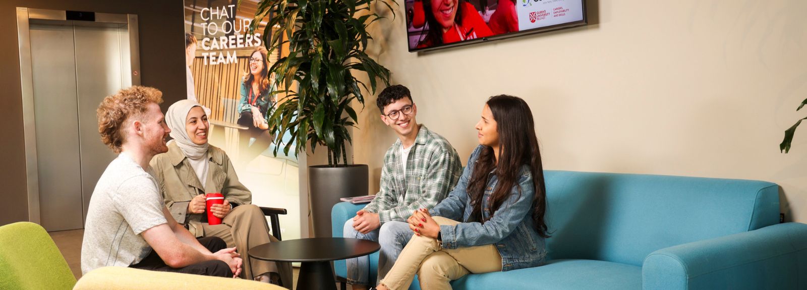 students sitting chatting on sofas